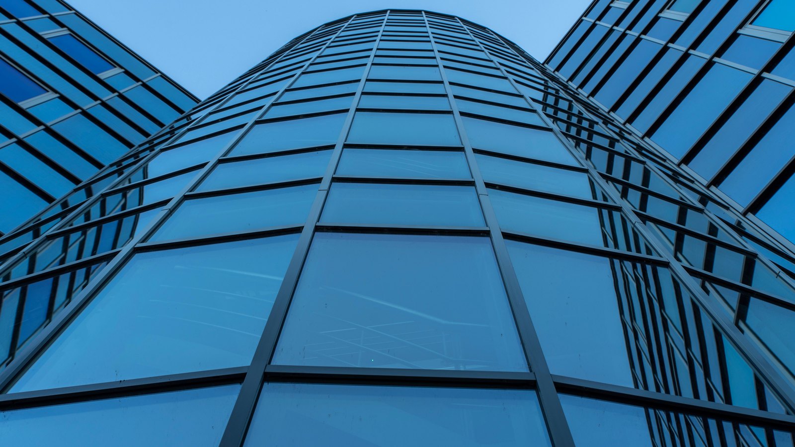 A modern glass corporate headquarters building.