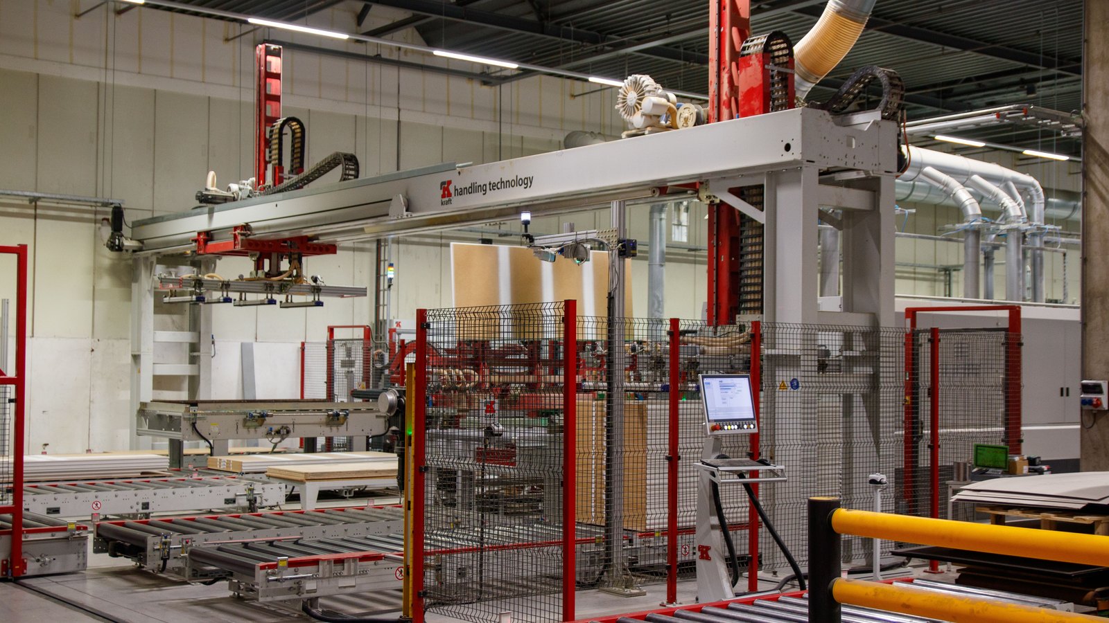 Automated production equipment on a factory floor.