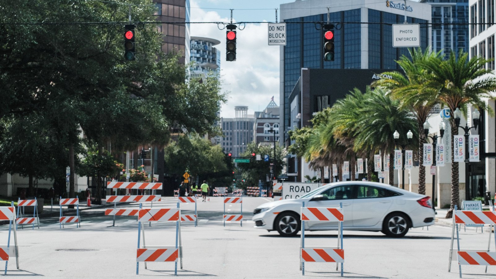 Road barriers line a Florida city street, an illustrative image and not a photograph of this event.