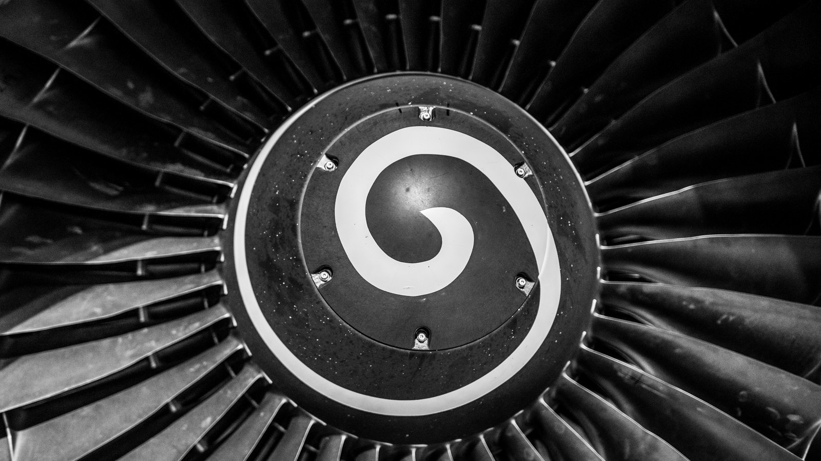 A photograph illustrating jet engine turbine blades macro.