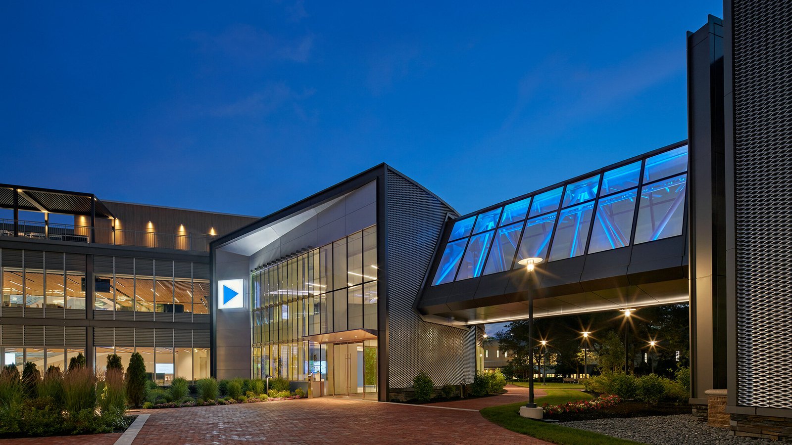 The Analog Devices campus in Wilmington, Massachusetts, lit at night.