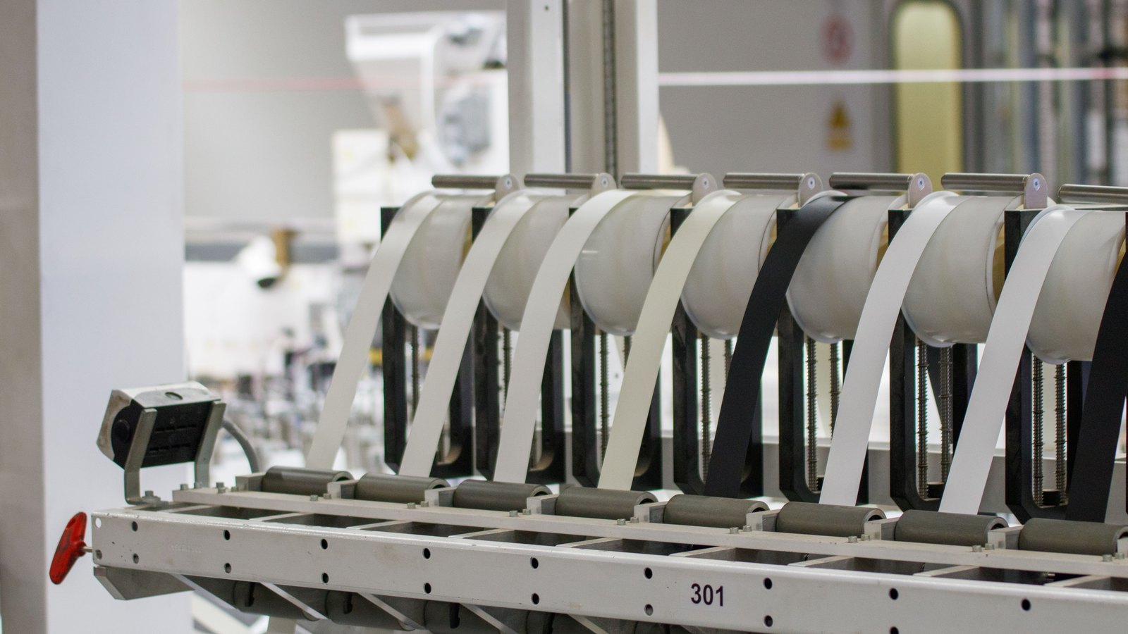 A photograph illustrating factory production line machinery.