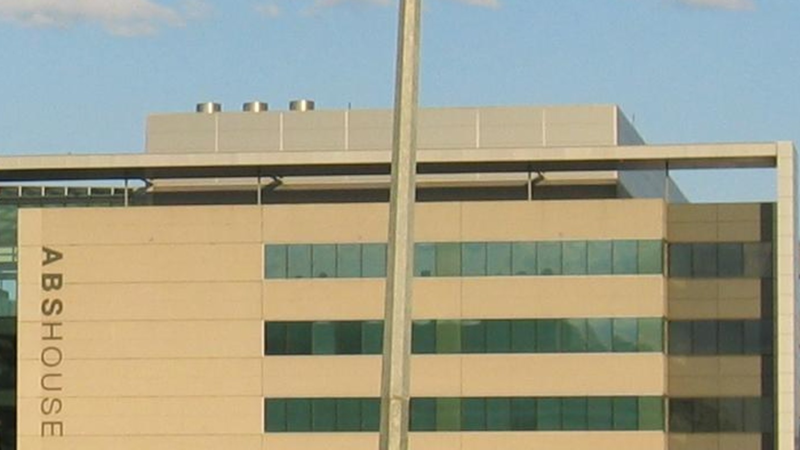 The upper facade of ABS House in Belconnen, with the building name beside rows of windows, photographed in December 2006.