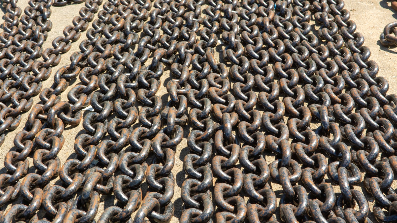 A photograph illustrating ship anchor chain links macro.