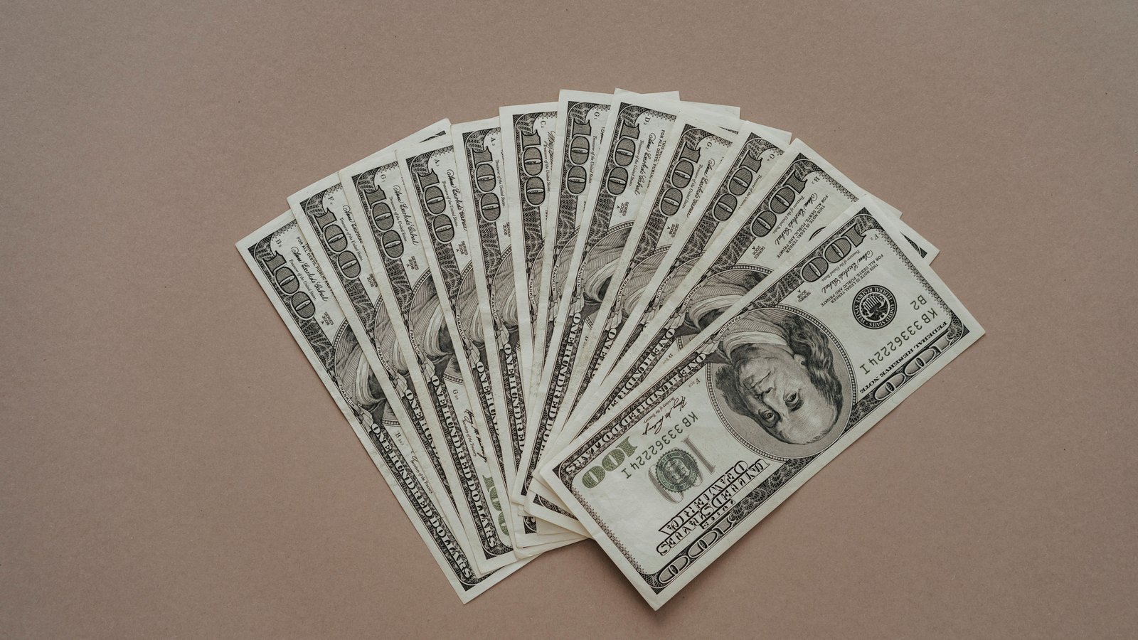 A photograph illustrating US hundred dollar bills fanned.