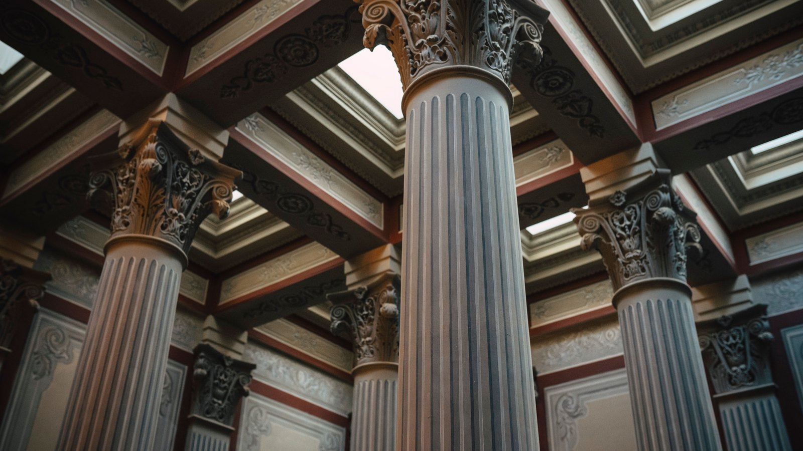 Ornate stone columns inside a neoclassical building.