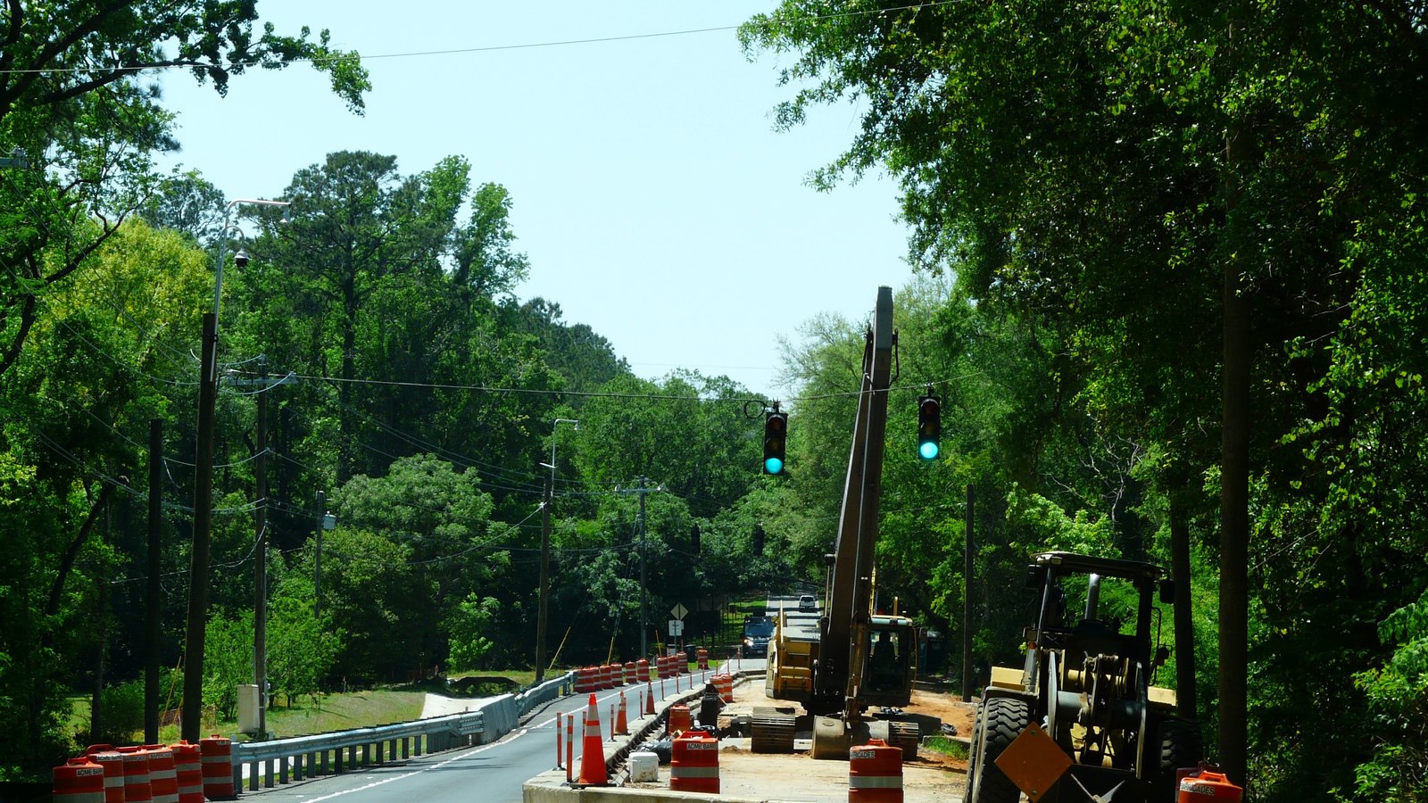 Traffic moves through a barrel-lined Florida roadwork zone, not a photograph of this project.