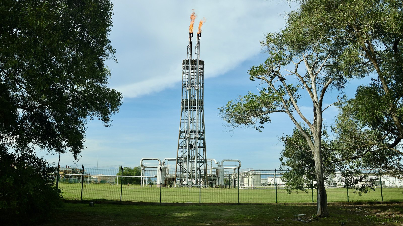 A flare stack burning at an oil refinery.
