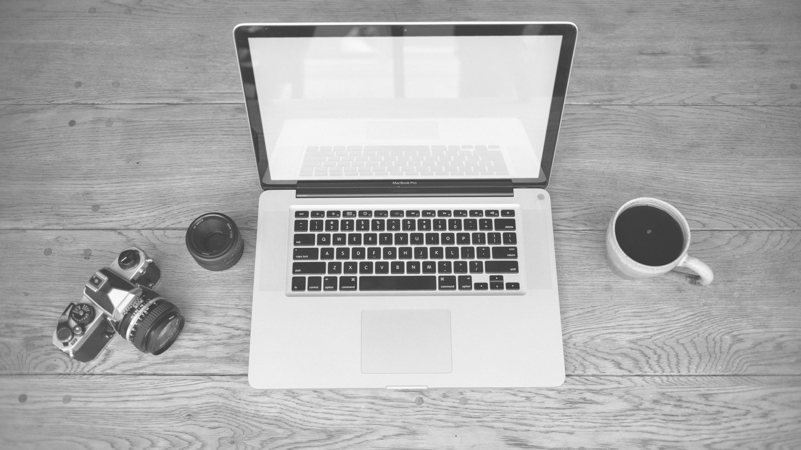A photograph illustrating laptop office desk.