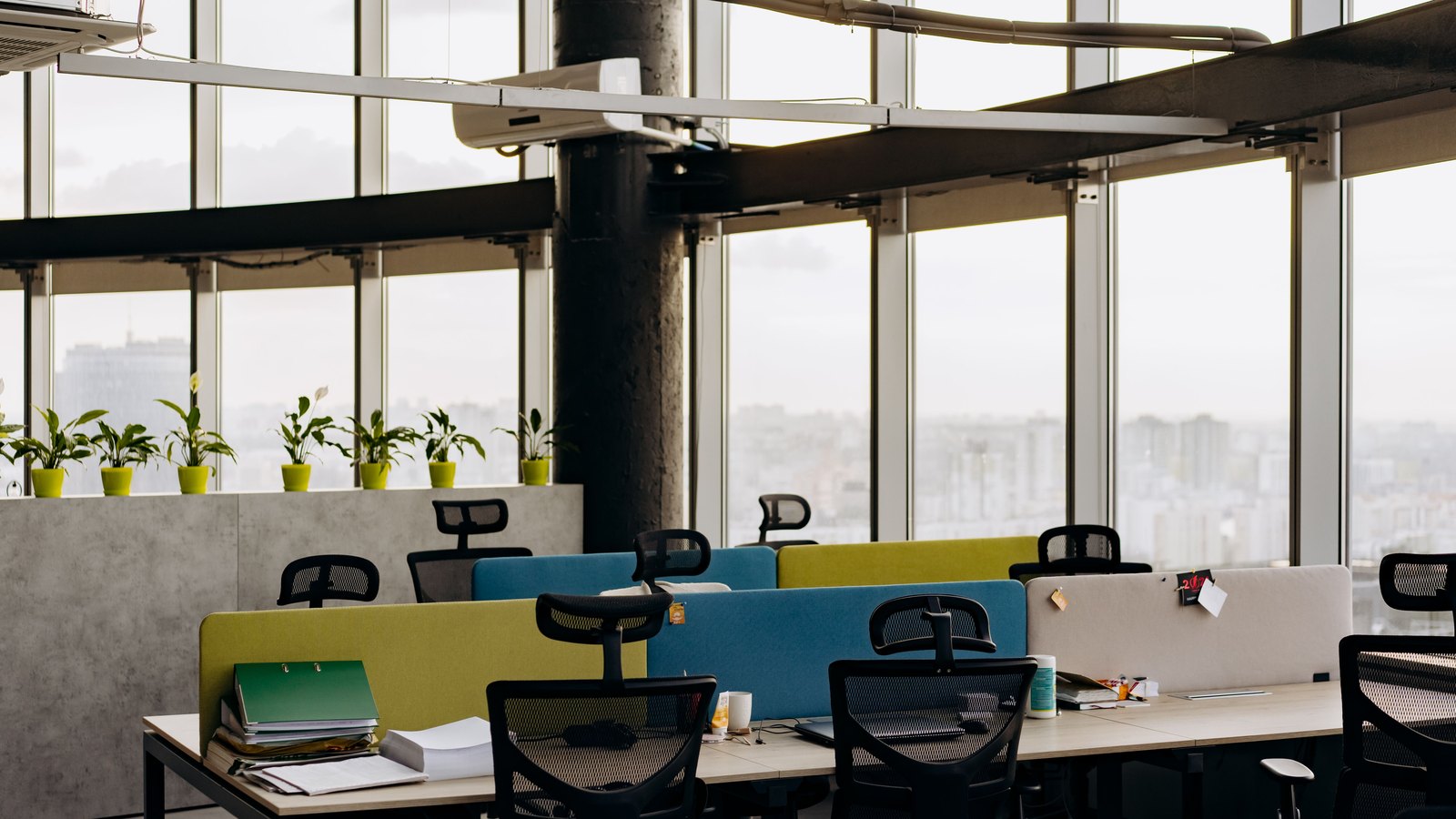 Unoccupied desks in an open office.