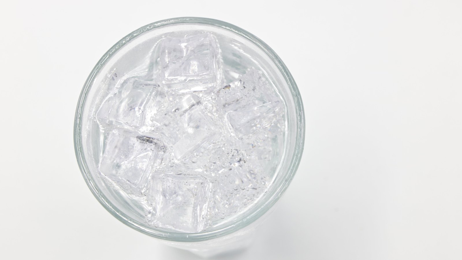 An overhead close-up of clear iced water in a glass, not a photograph of this advisory.