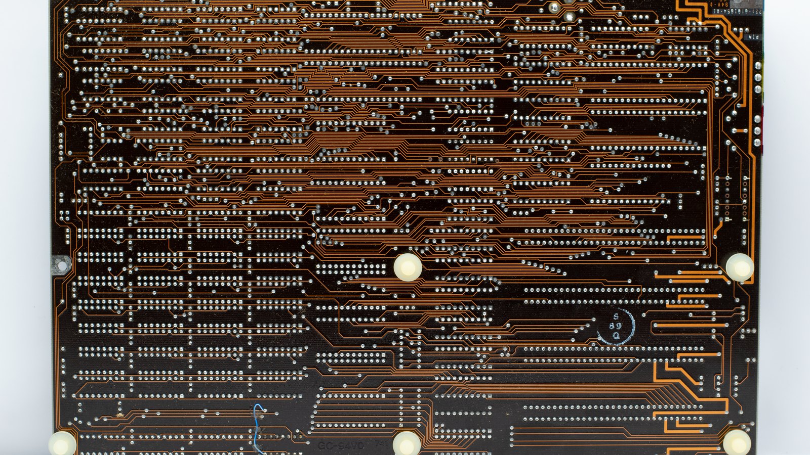 Copper traces cover the back of a circuit board.