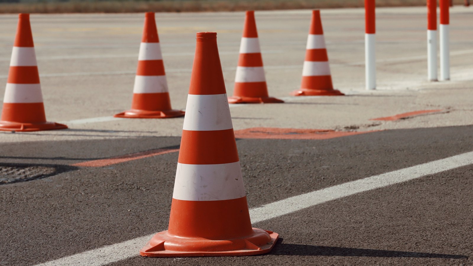 Orange and white traffic cones on pavement, not a photograph of this event.