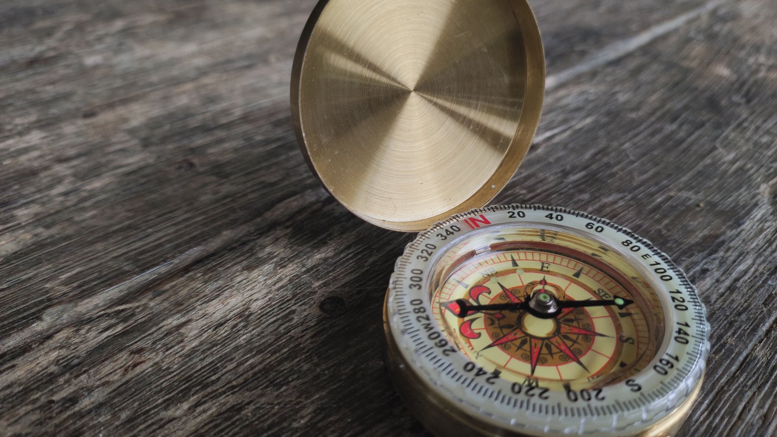 A photograph illustrating brass compass needle closeup.