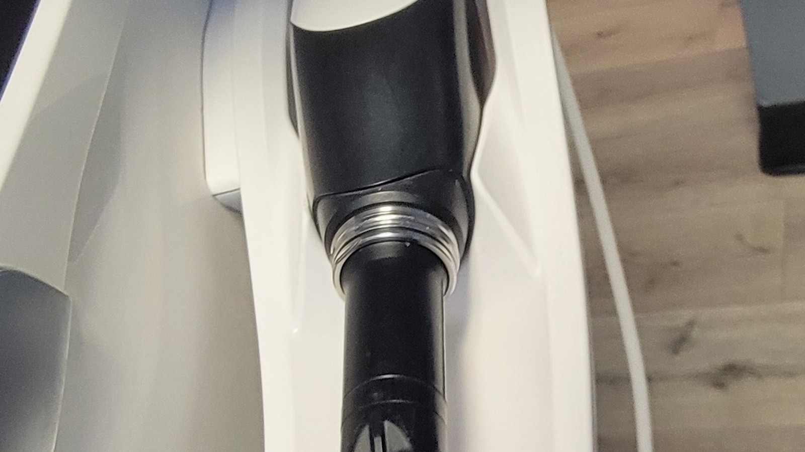 A Dentsply Sirona Primescan intraoral scanner resting in its cradle.