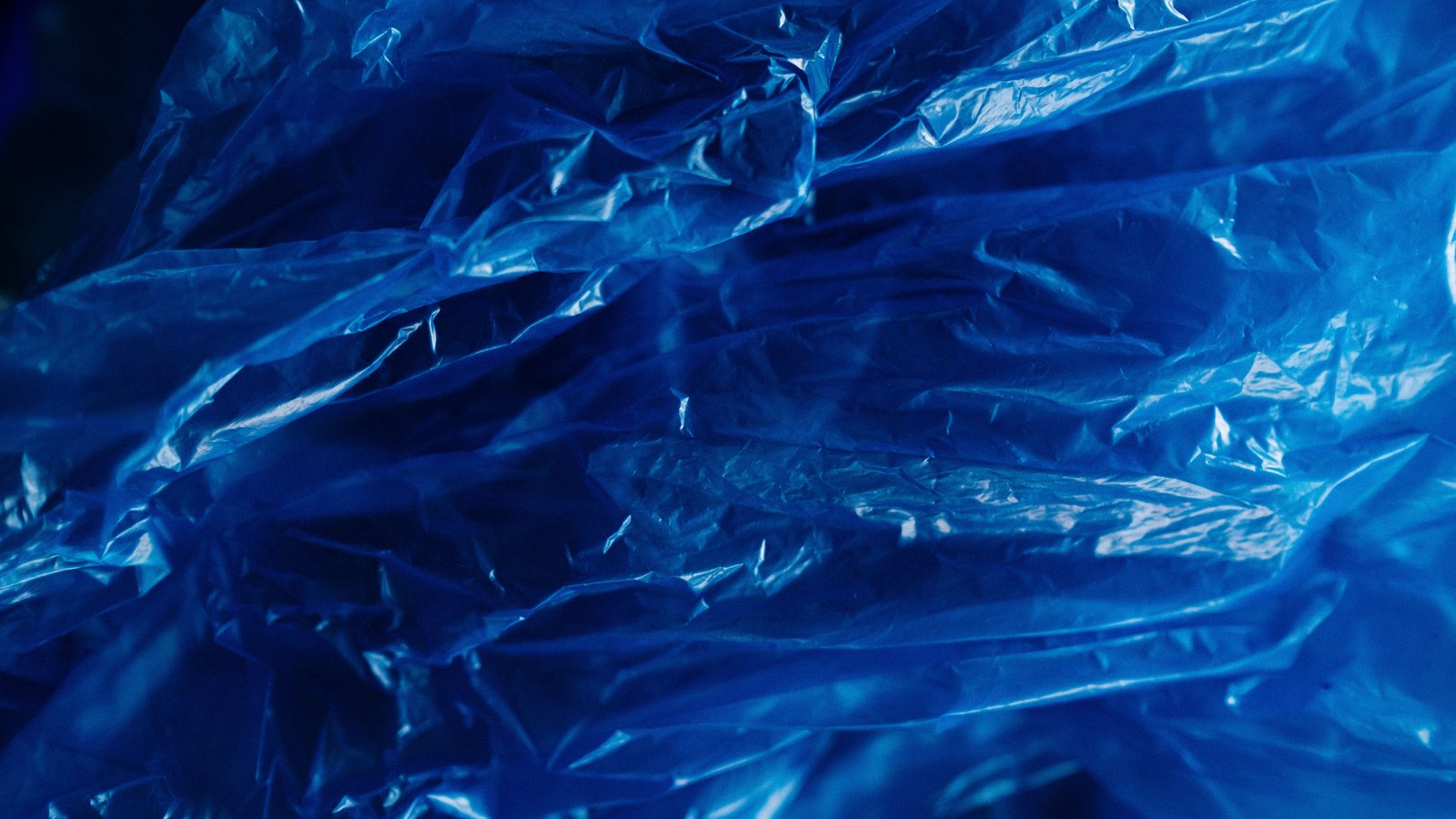 A photograph illustrating plastic resin pellets macro.