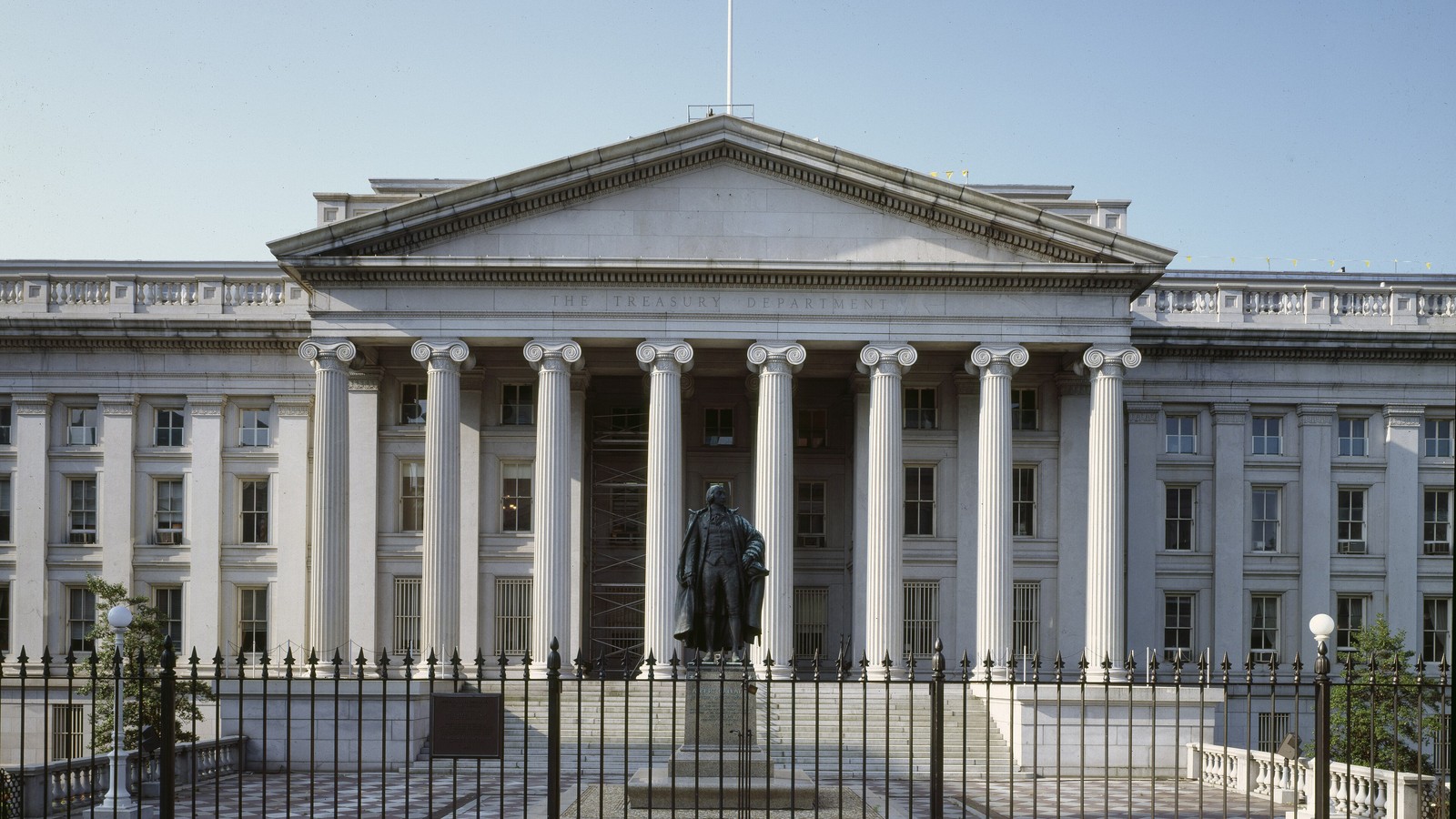 The United States Treasury Department building behind its front fence in Washington.