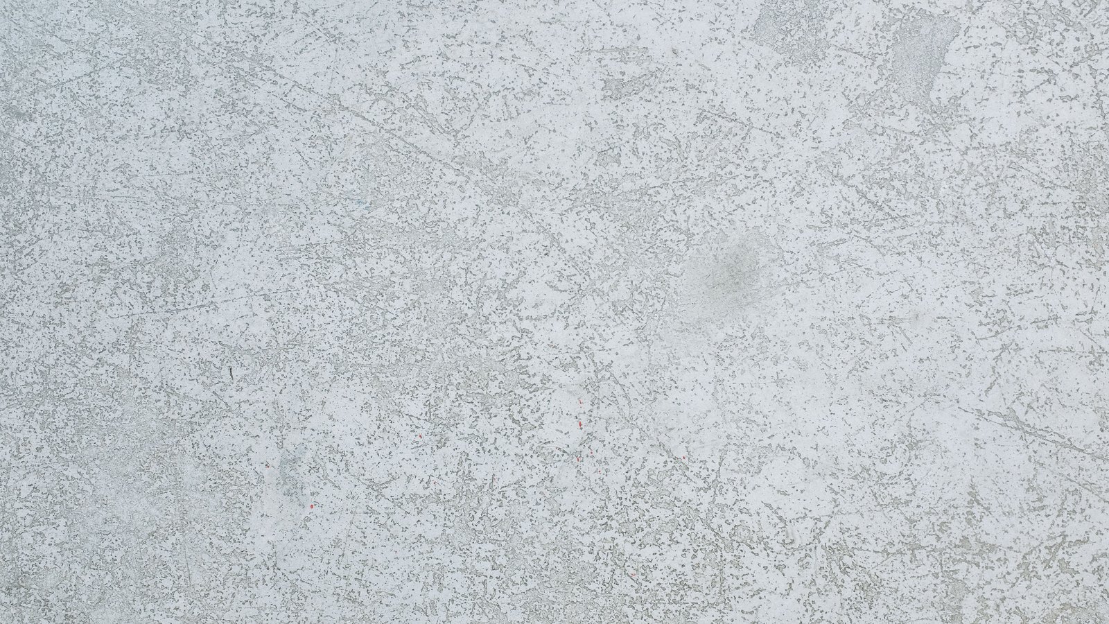 A close crop of plain weathered grey concrete, used as an illustration. It is not a photograph of the Edison Bridge.