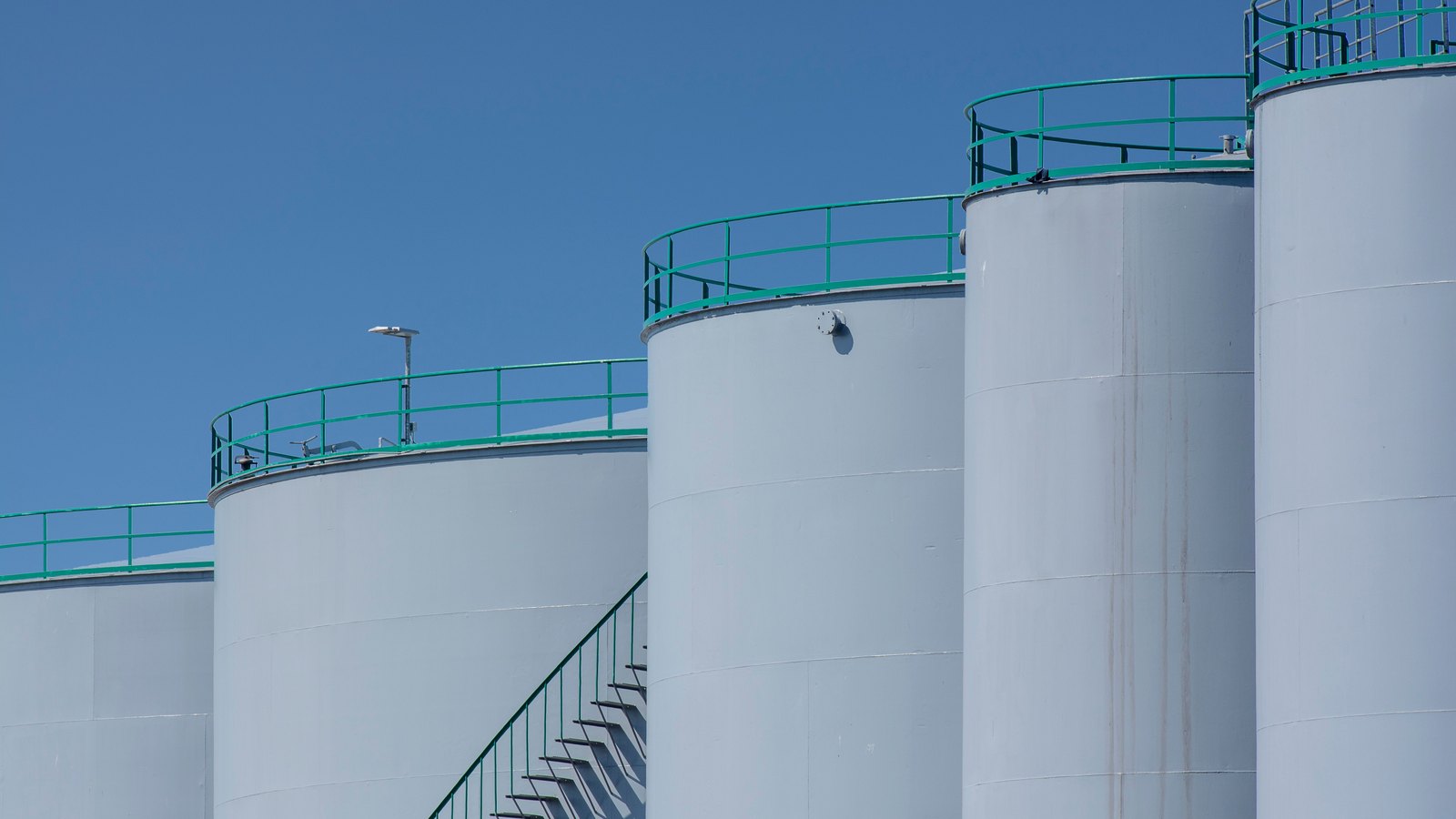 A photograph illustrating oil storage tanks.