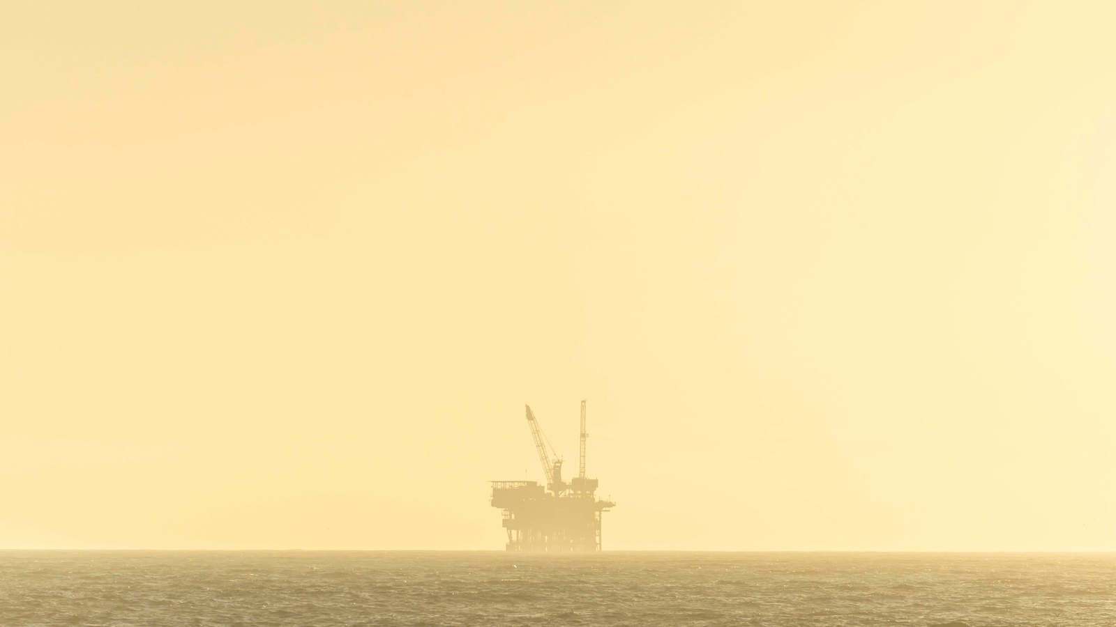 A photograph illustrating offshore oil platform at sea.