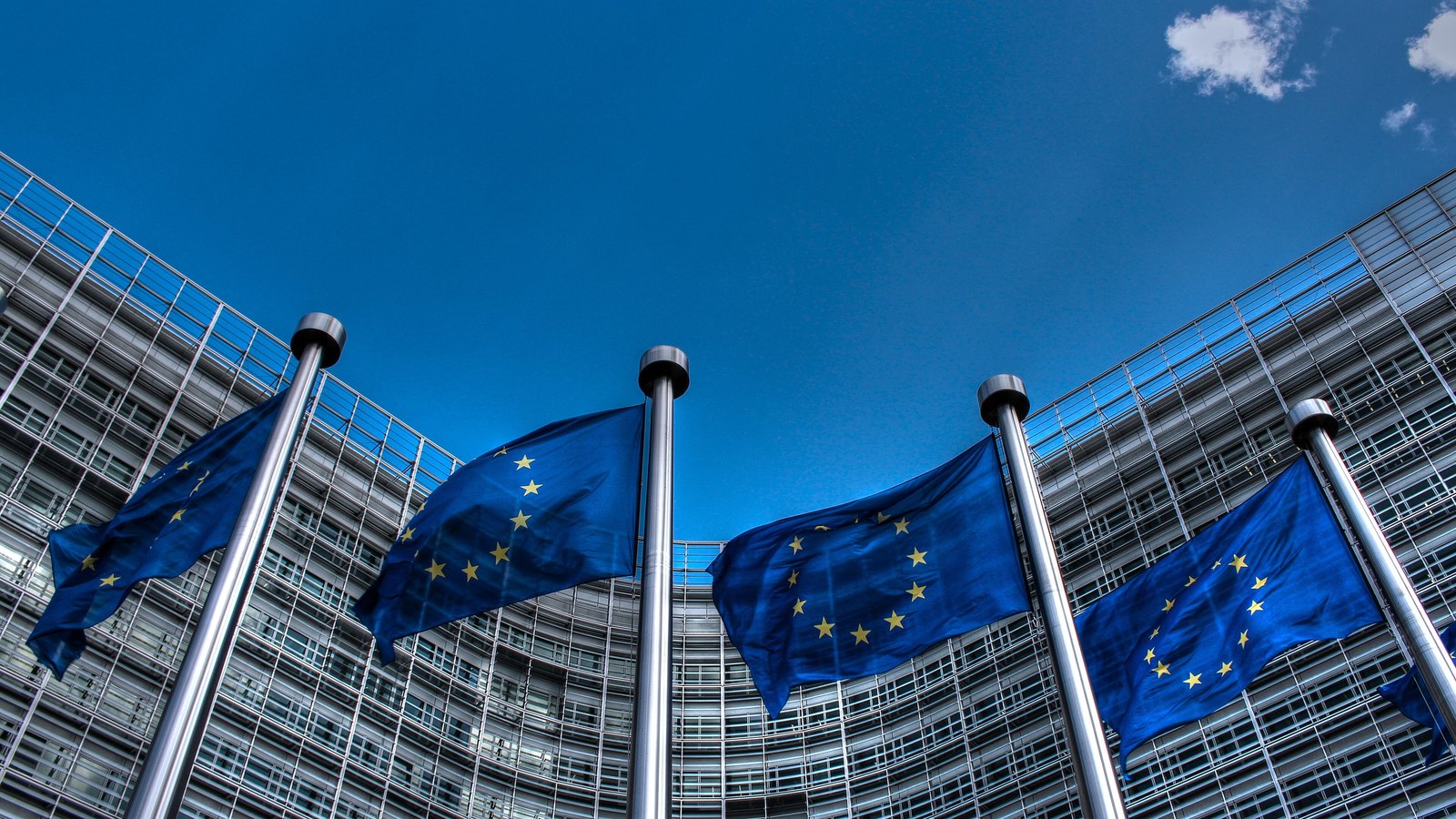 European Union flags fly outside the European Commission's Berlaymont building in Brussels.