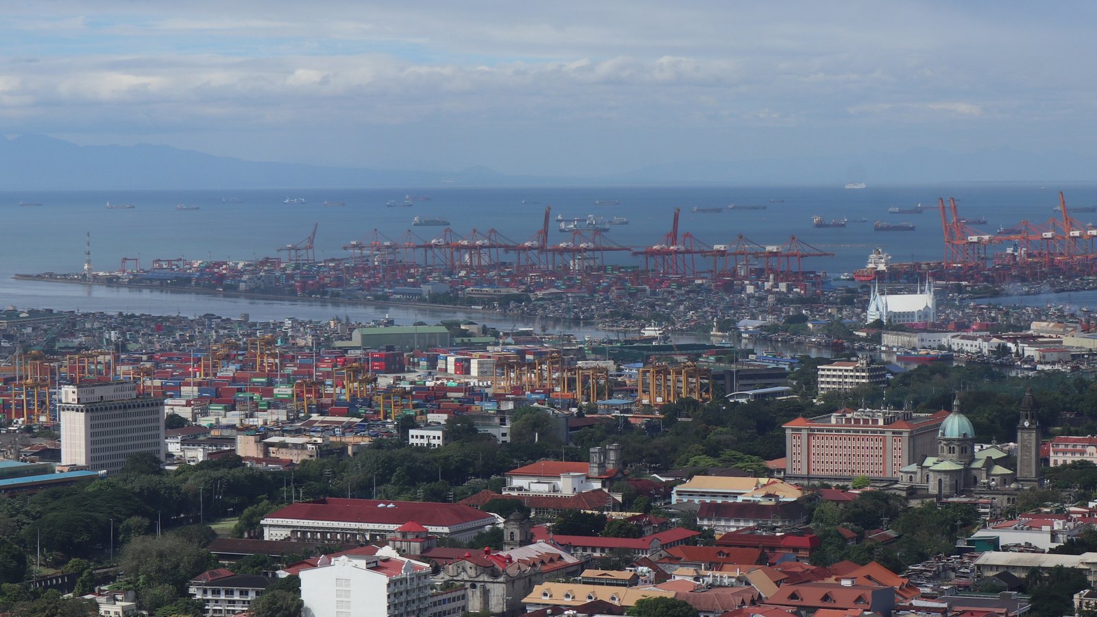 The Manila International Container Terminal and central Manila viewed from above.