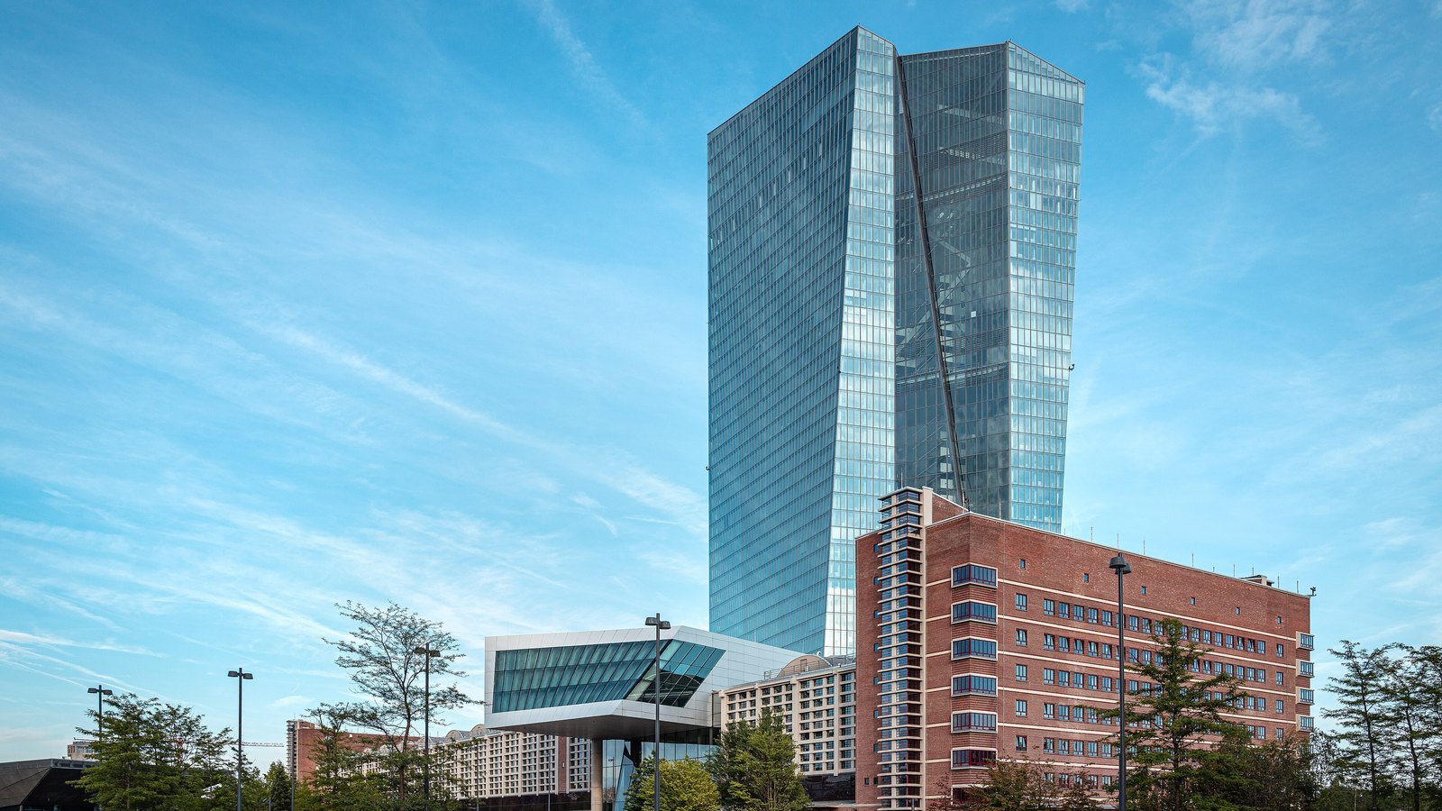 The European Central Bank headquarters rises above its former wholesale market building in Frankfurt.