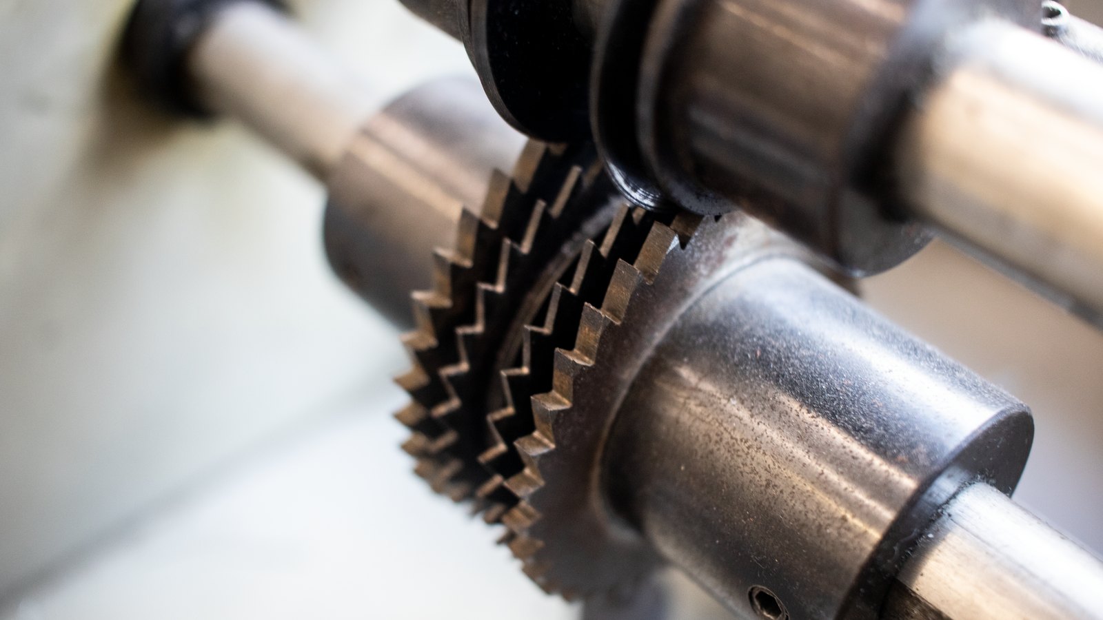 A photograph illustrating interlocking metal gears.