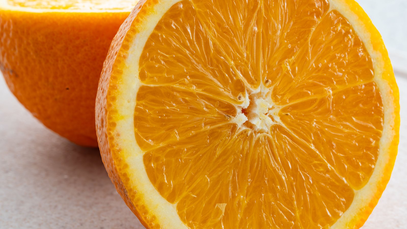 A photograph illustrating orange halved macro.