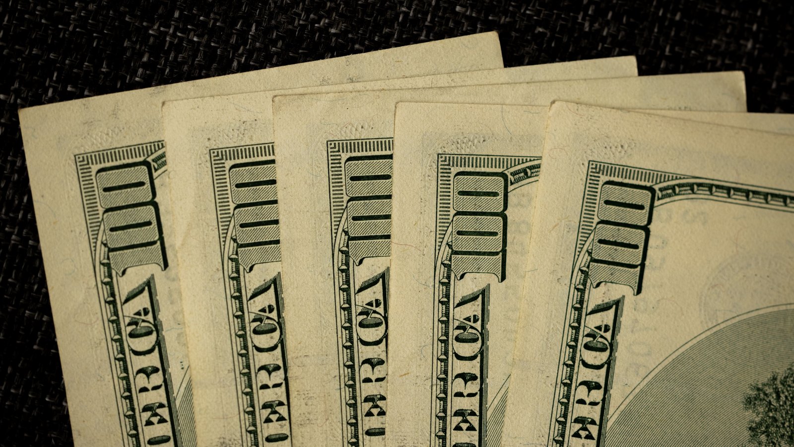 A photograph illustrating dollar banknote closeup.