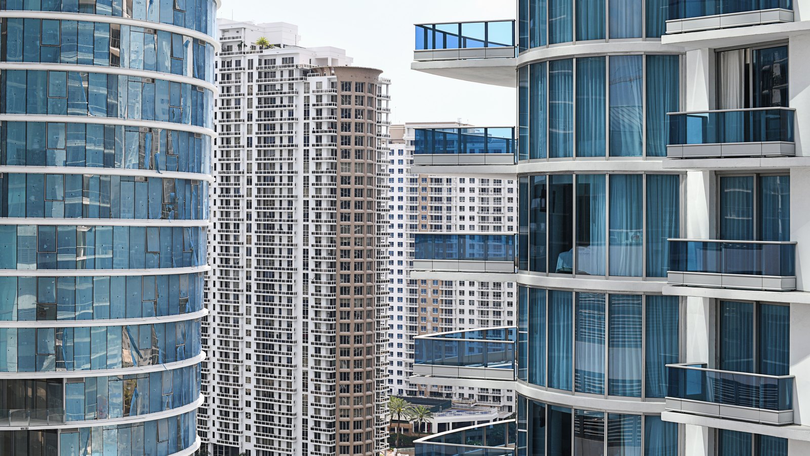 Florida condominium towers with glass-fronted balconies, not a photograph of the association in the ruling.