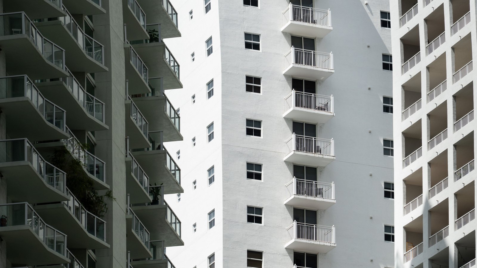 Modern residential towers with stacked balconies in Miami, not the condominium involved in this case.