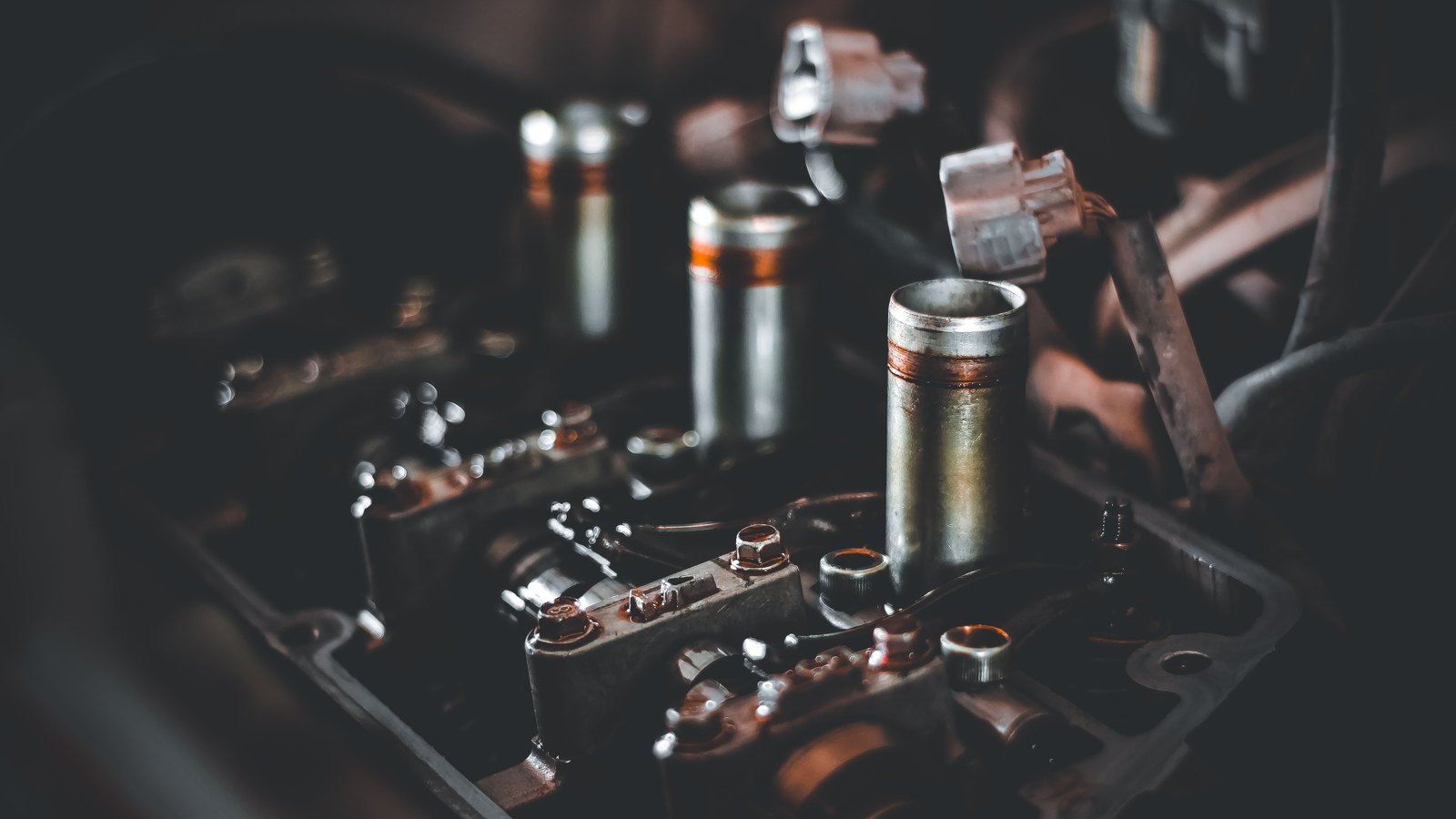 A photograph illustrating engine pistons metal macro.