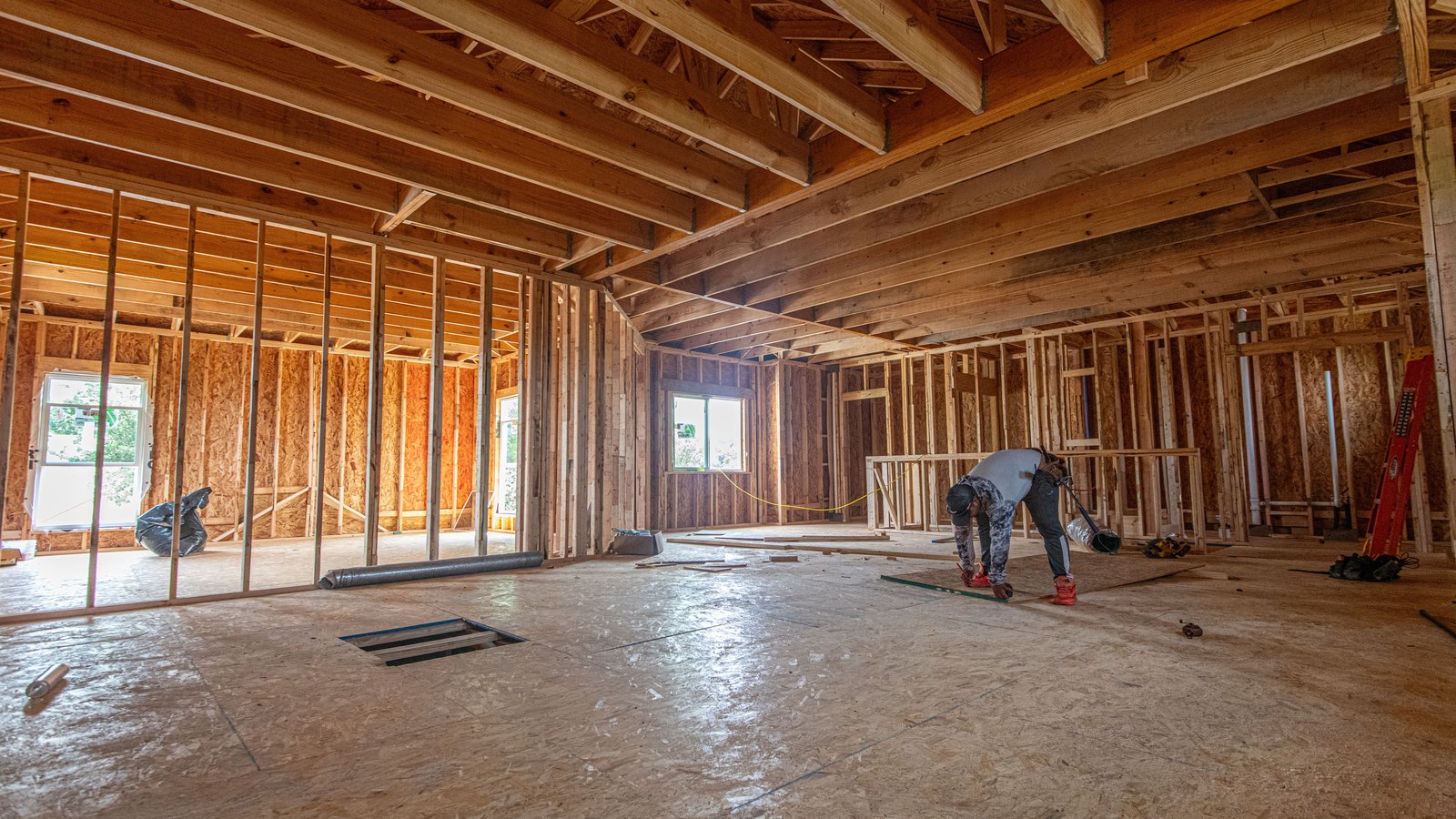 A photograph illustrating wood house framing construction.