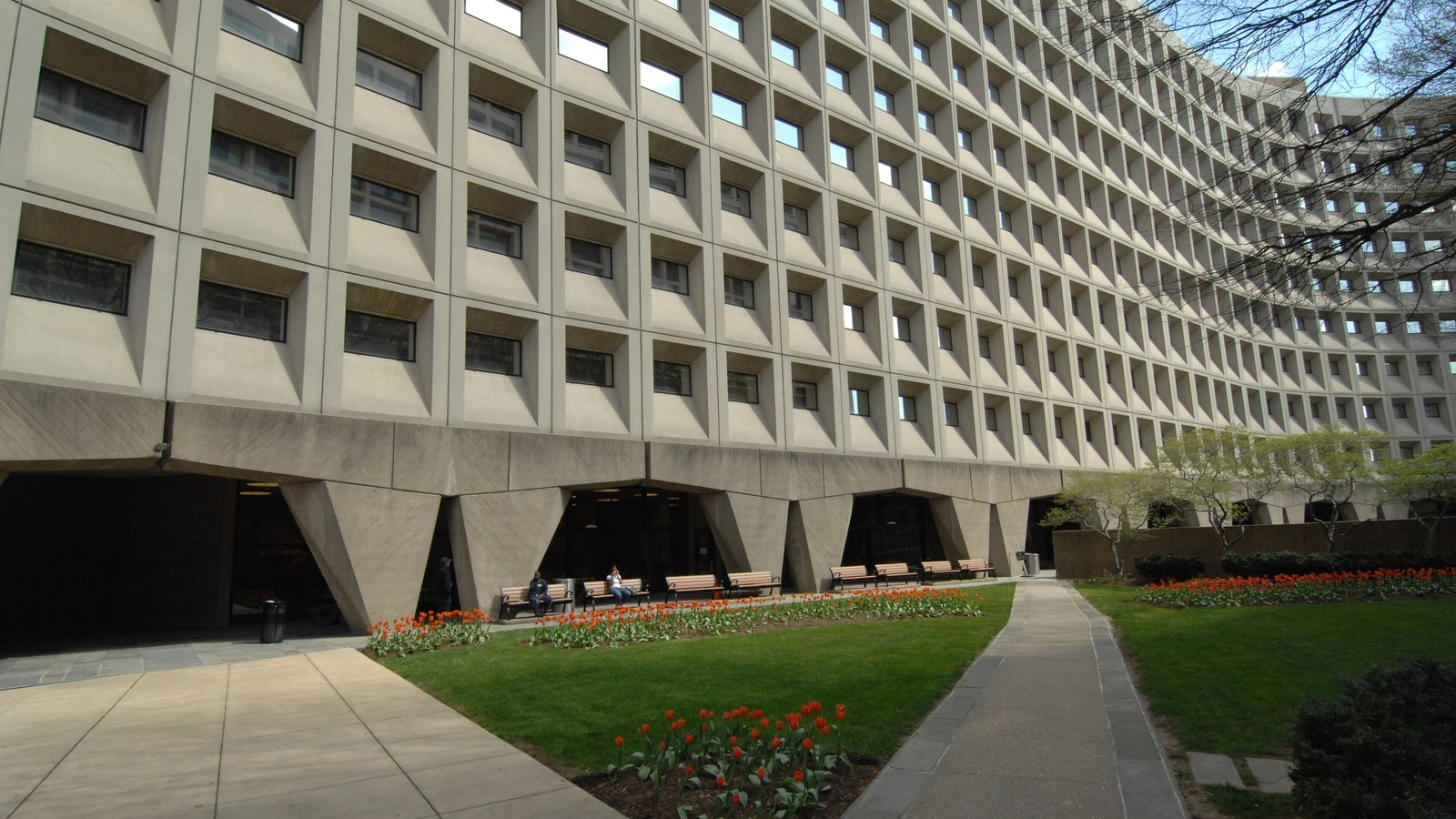 The courtyard and curved facade of the Robert C. Weaver Federal Building, headquarters of the Department of Housing and Urban Development.