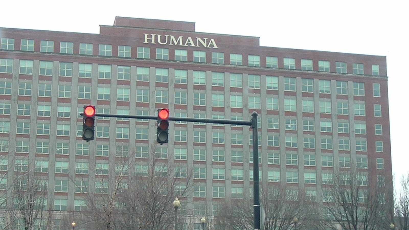 An archival photograph of a Humana office building in Louisville, with the company name above rows of windows.