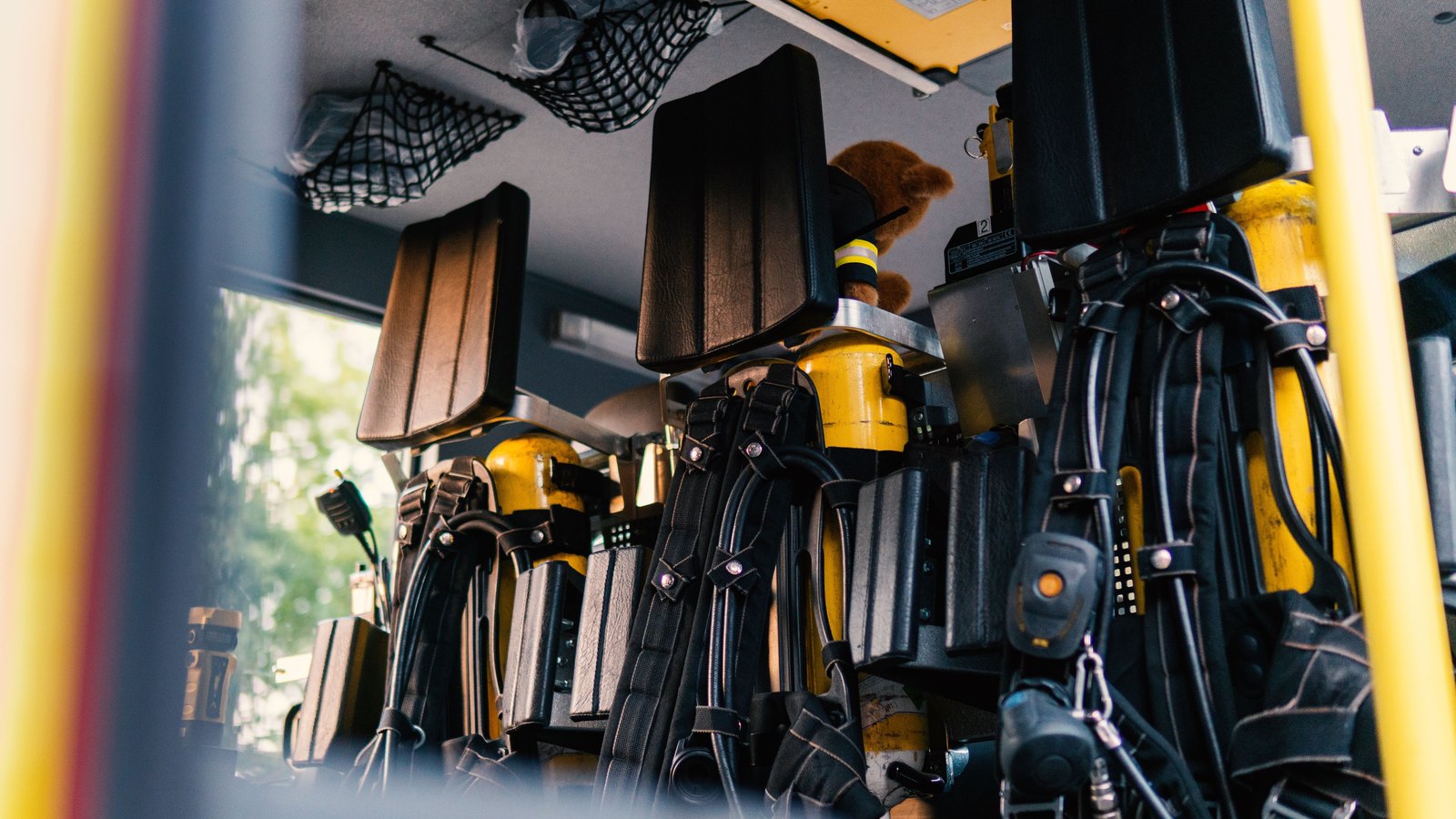 Breathing equipment and rescue gear are stored inside a fire engine, not a photograph of this event.