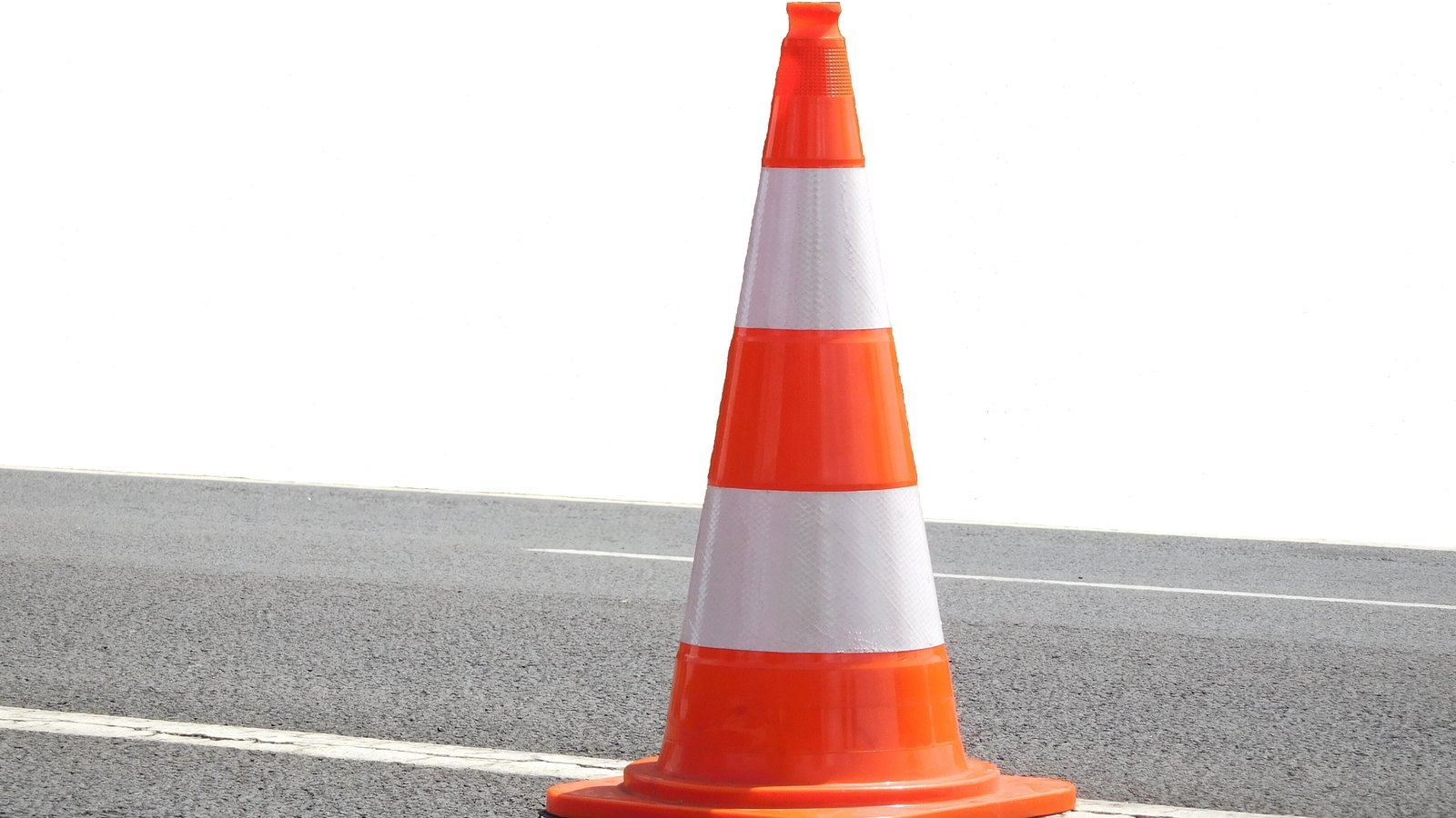 A generic orange traffic cone on pavement. This is not a photograph of this crash.
