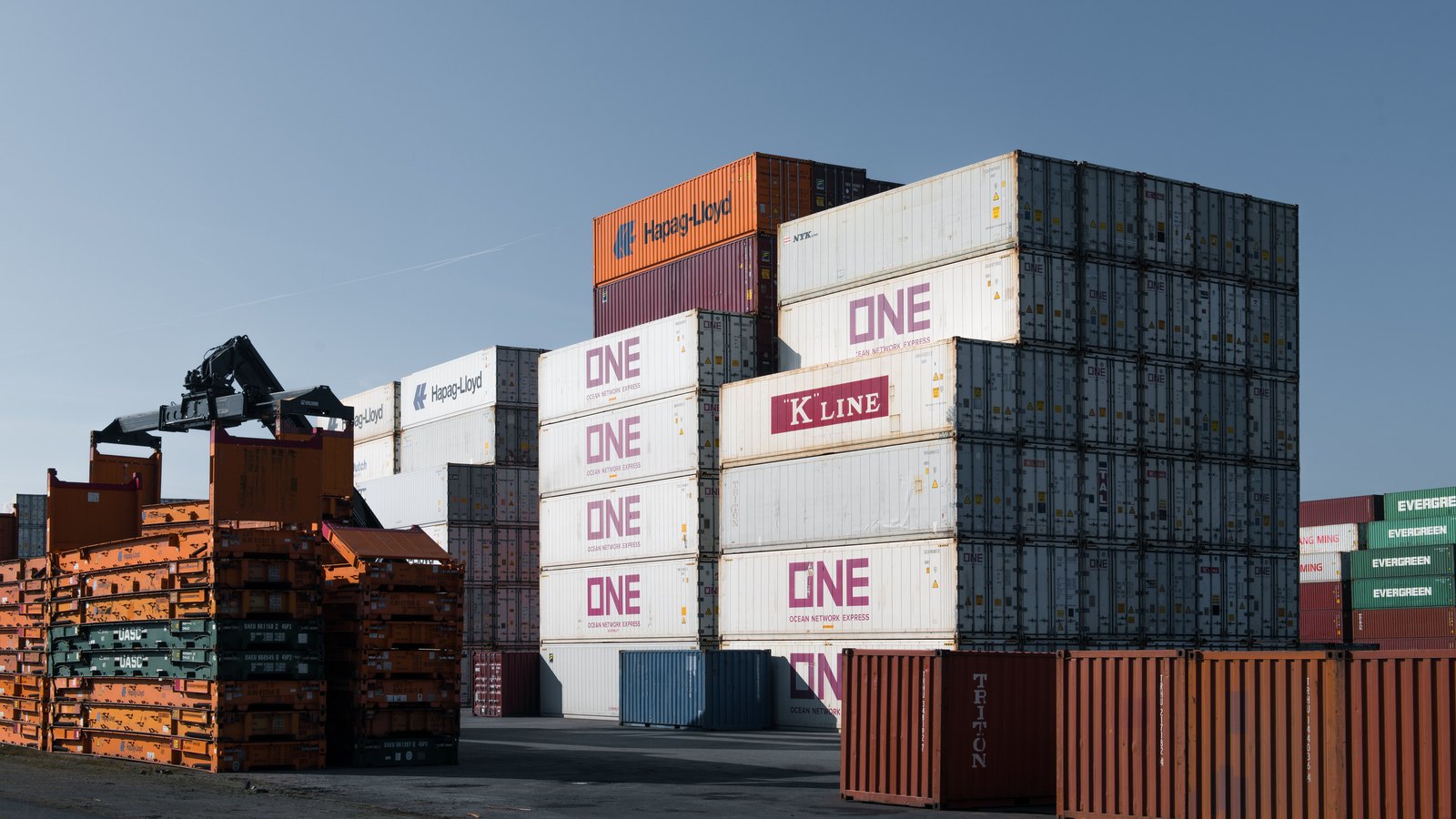A photograph illustrating shipping containers port.
