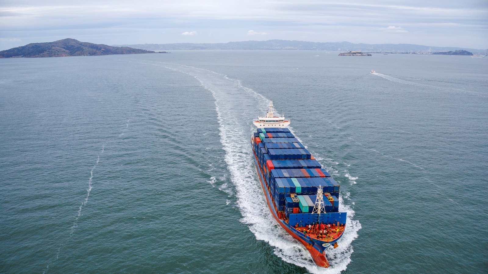 A photograph illustrating container ship ocean aerial.