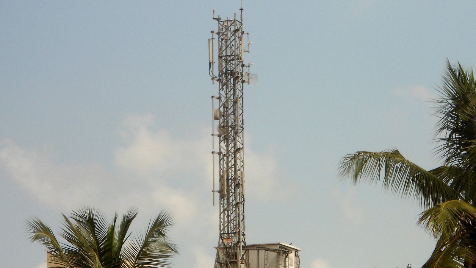 A mobile communications tower above rooftops in Kakinada, India.