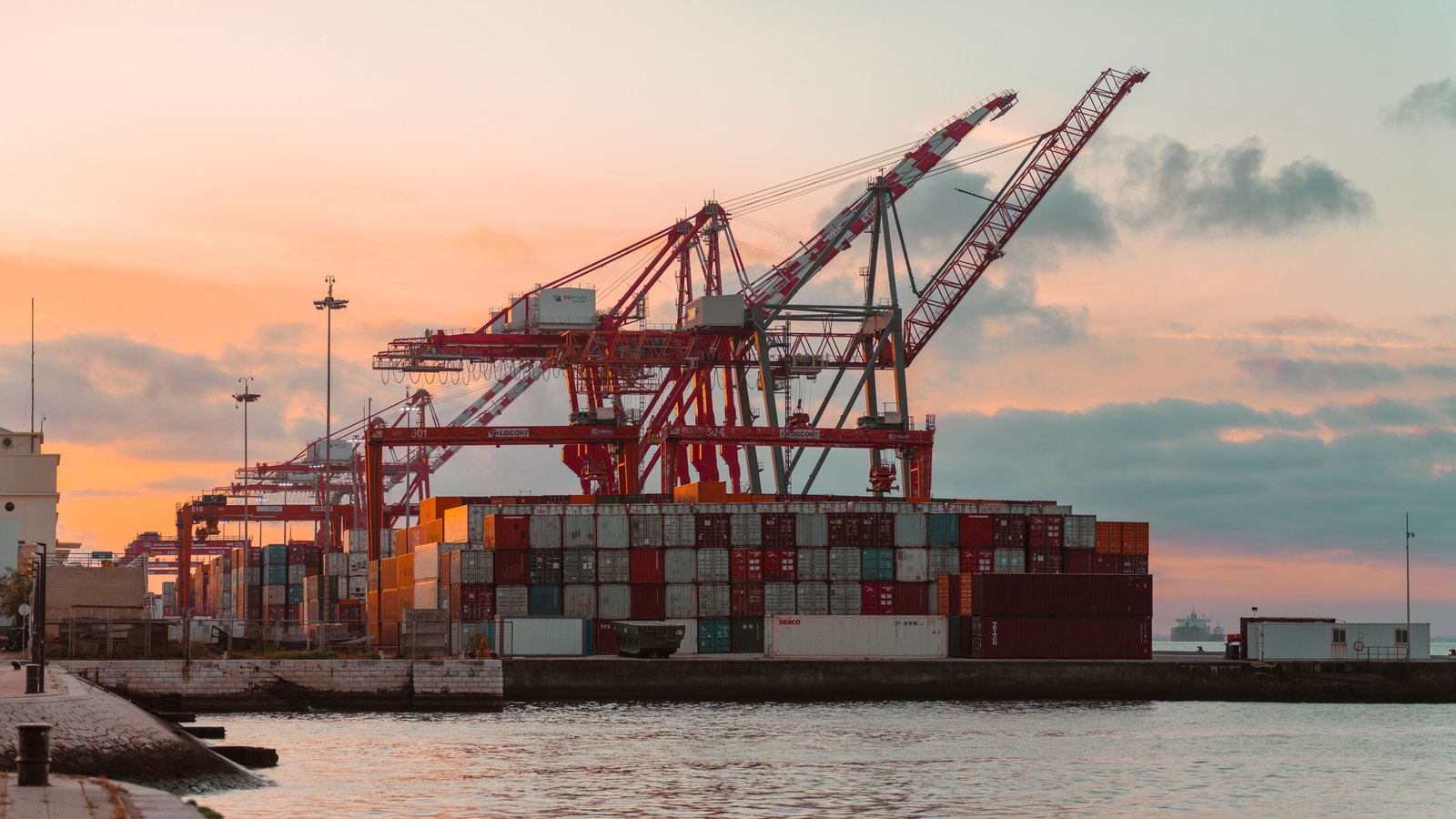 A photograph illustrating port container cranes.