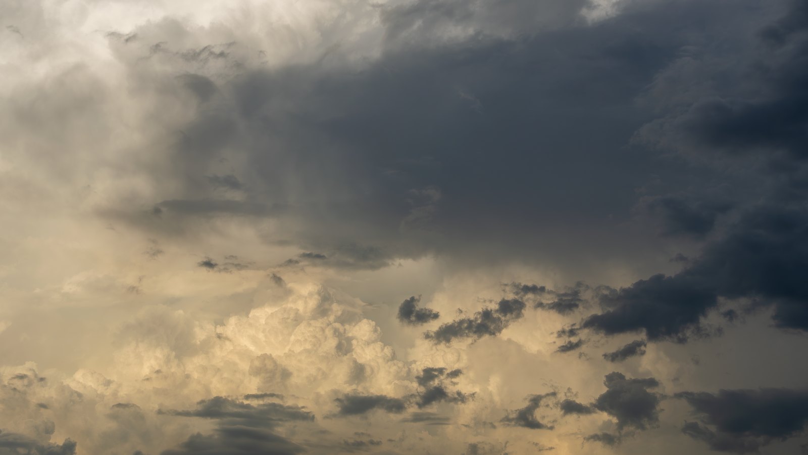 Dark storm clouds fill the sky, not a photograph of this event.