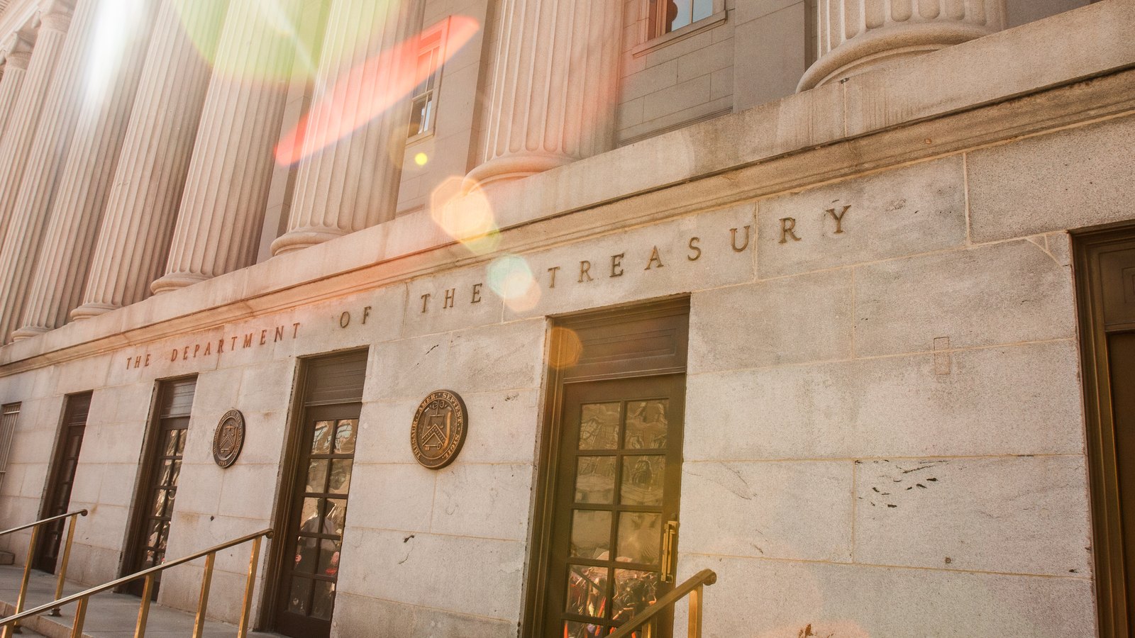 Stone columns and the Department of the Treasury name on the agency building in Washington.