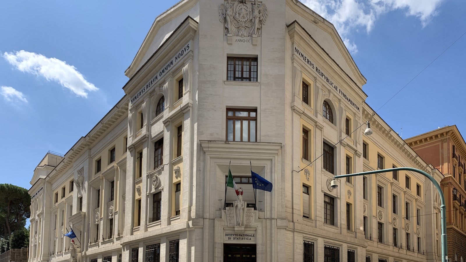 The Istat headquarters on Via Cesare Balbo in Rome beneath a blue sky.