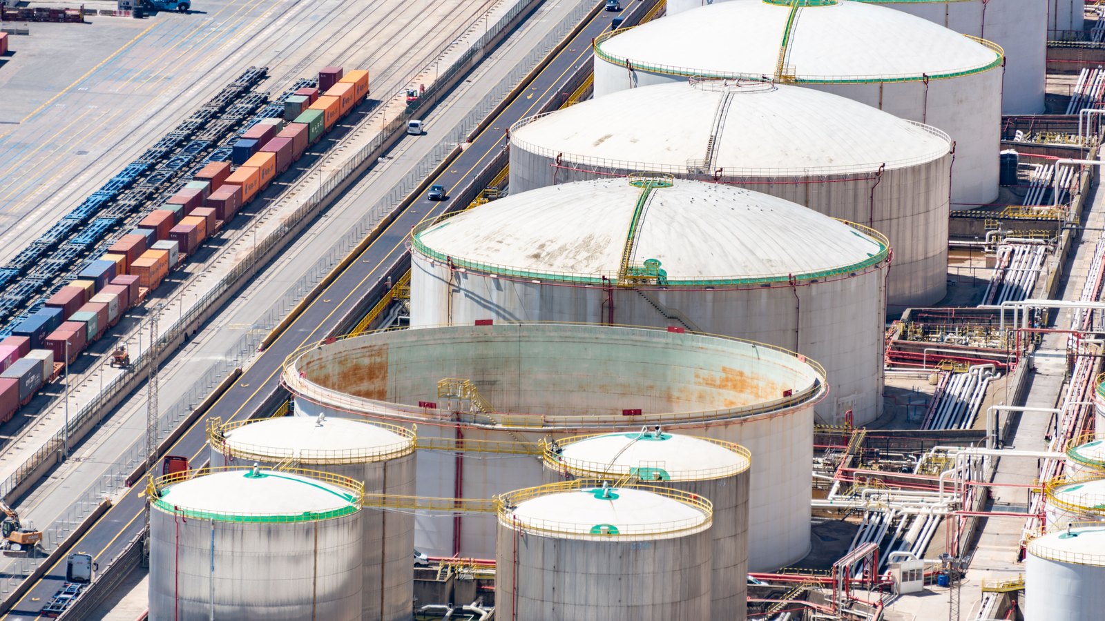 A photograph illustrating oil storage tanks aerial.
