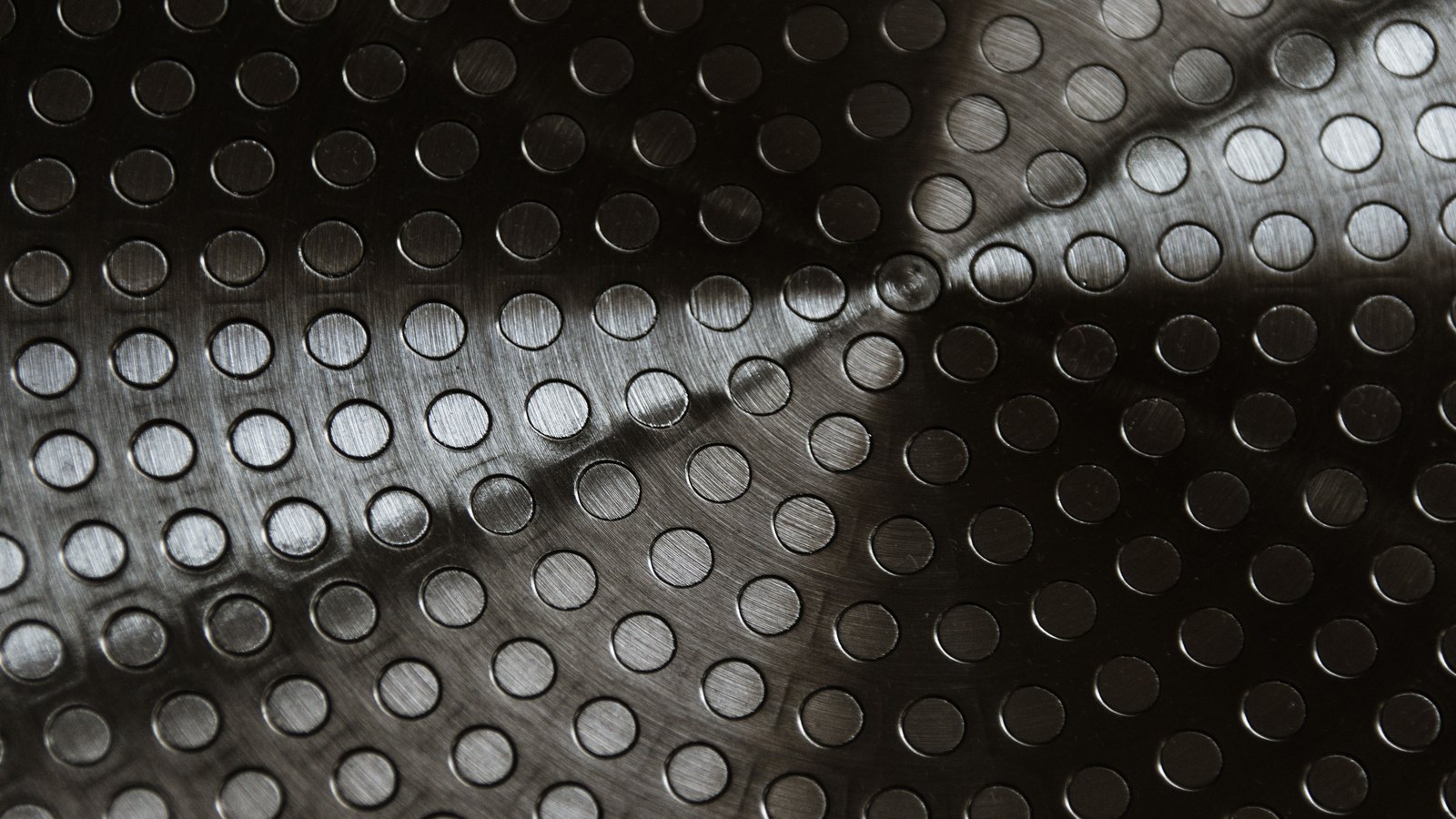 A photograph illustrating brushed steel metal surface.