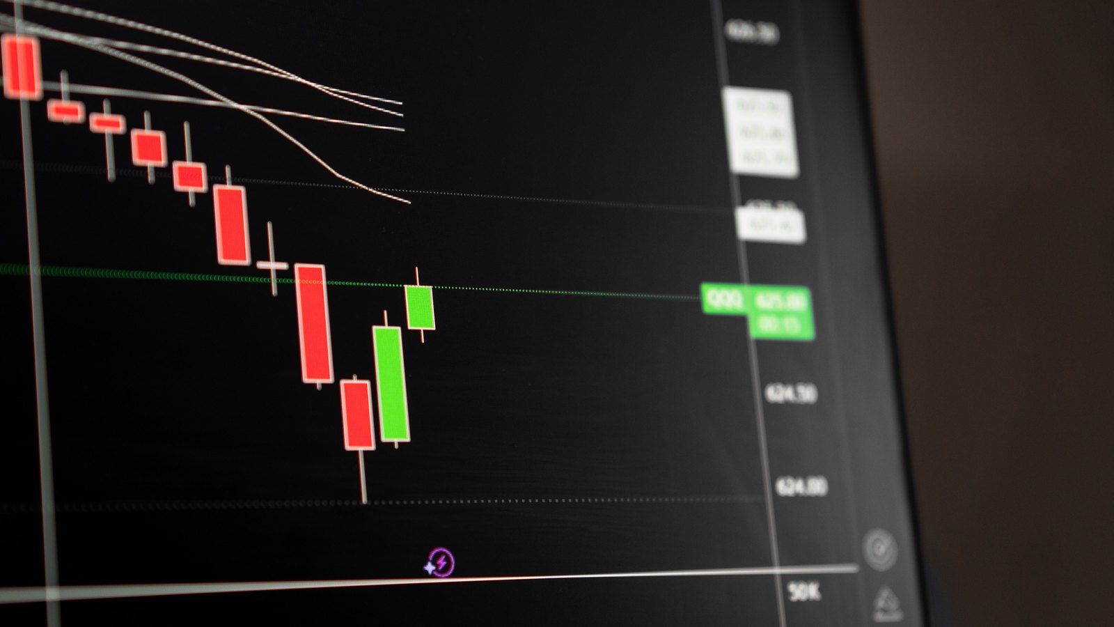 A photograph illustrating red candlestick stock chart.