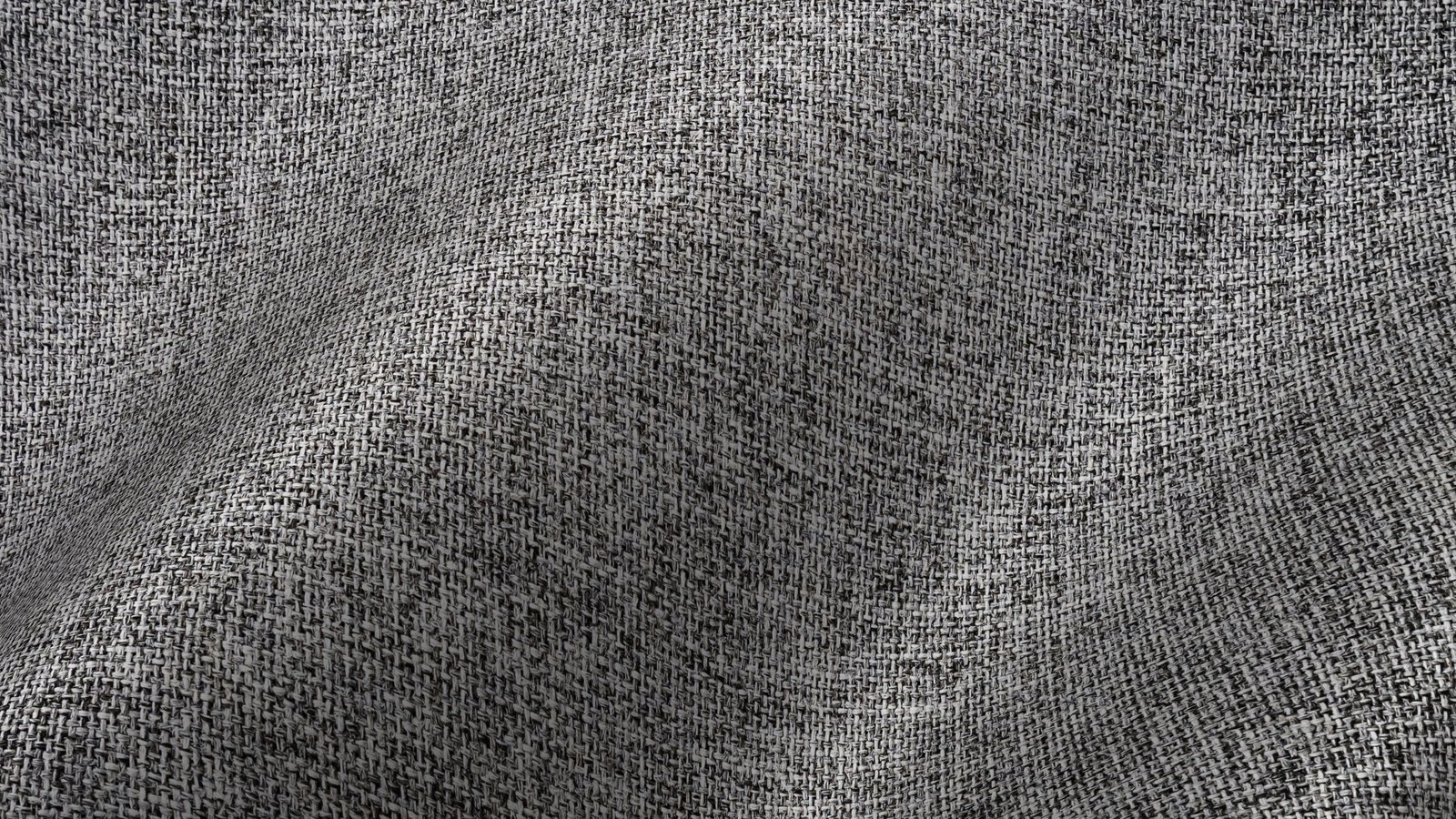 A close photograph of coarse grey woven fabric filling the frame, the weave visible thread by thread, with soft folds running diagonally across it.