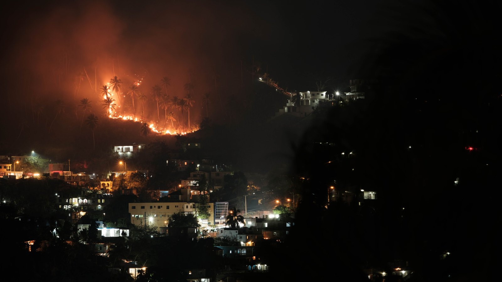 A fire and rescue truck responding at night.